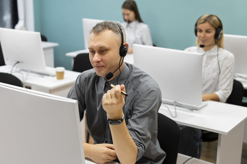 colleagues working together call center office
